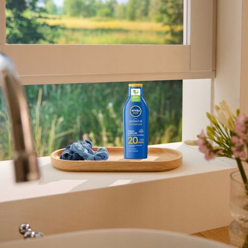 NIVEA SUN Protect & Moisture Balsam do opalania SPF 20, 200 ml na Arena.pl