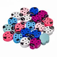 Drewniane koraliki BIEDRONKA 14x19mm mix 20szt.