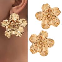 KOLCZYKI złote kwiaty przy uchu rozłożyste lustrzane boho glamour elegancki