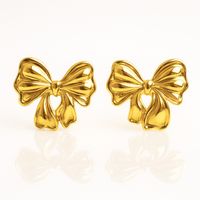 kolczyki ze stali szlachetnej pozłacane 14k złotem, kokardki kst3476