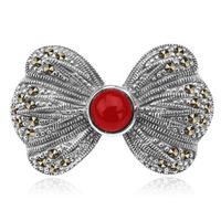 broszka srebrna kokarda z markazytami i koralem