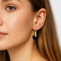 KOLCZYKI SWAROVSKI ZŁOTE SERCA WISZĄCE, CZARNE, SREBRO PR. 925, POZŁACANE