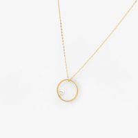 Naszyjnik złoty ANIA KRUK kółko biała perła złoto 375