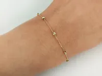 Złota bransoletka 585 małe kuleczki diamentowane kulki z kulek delikatna