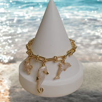 Bransoletka z perłowymi, morskimi zawieszkami z kolekcji Oceanique