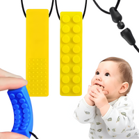 GRYZAK LOGOPEDYCZNY ZABAWKA SENSORYCZNA ŻÓŁTY KLOCEK NASZYJNIK SILIKON