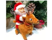 mikołaj z reniferem na baterie wys. 20 cm