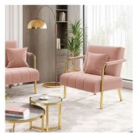 Fotel do salonu różowy złota rama z poduszką