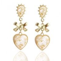 kolczyki vintage z kokardką jasne k1577