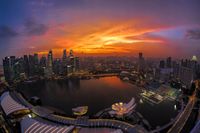 FOTOTAPETA ZACHÓD SŁOŃCA BUDYNKI WIEŻOWCE WODA