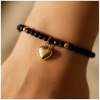 ZŁOTA BRANSOLETKA DAMSKA NA RĘKĘ Z CZARNYMI KORALIKAMI CELEBRYTKA +