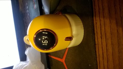 Lampka nocna z projektorem i zegarem - żółty/złoty na Arena.pl