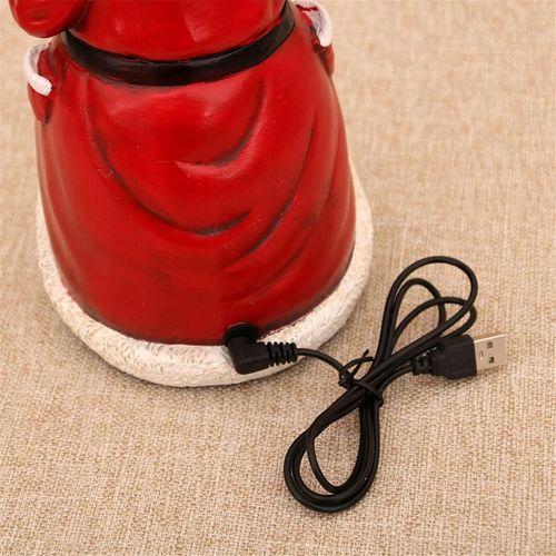 Figurka Święty Mikołaj z poruszającym się pociągiem światłami LED muzyką na Arena.pl