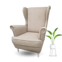 FOTEL USZAK NA DREWNIANYCH NÓŻKACH PIKOWANY