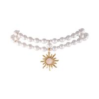 podwójny choker z satynowych pereł ze słoneczkiem (c25/kor/26au)