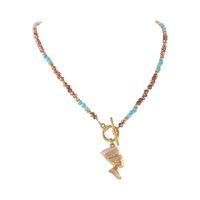 naszyjnik z turkusami z zawieszką nefretete (c25/lat/92au)