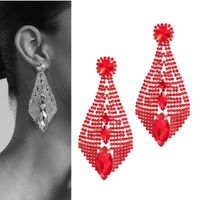 Okazałe złote czerwone kolczyki sztyfty kryształkami żyrandole bogate żywe