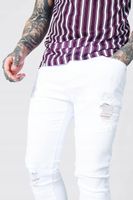 BIAŁE SPODNIE JEANS RURKI TEKSTURA DZIURY BOOHOOMAN XS