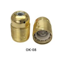 OPRAWKA E27 OSŁONKA DEKORACYJNA METALOWA MOSIĄDZOWANA  KARBOWANA