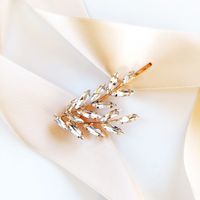 ZŁOTA ozdoba do włosów z cyrkoniami LISTKI elegancka i błyszcząca ŚLUBNA