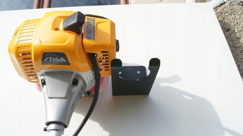 WIESZAK UCHWYT DO ŚCIANY MOCOWANIE DO KOSY SPALINOWEJ PODKASZARKI na Arena.pl