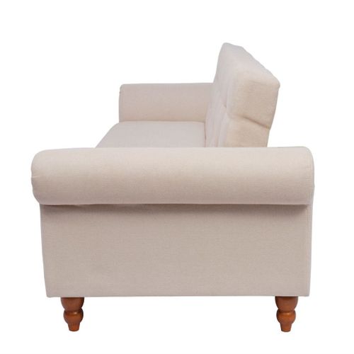 Sofa z kremowego materiału na Arena.pl