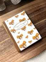 CIASTKO DZIENNIK W OŁÓWKOWE KOKARDY