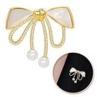 broszka ozdobna złota kokardka  masa perłowa i cyrkonie bz197