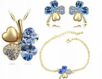 Złoty komplet biżuterii koniczynki niebieskie pozłacany na prezent