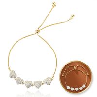 bransoletka na rękę stal chirurgiczna pozłacana 14k złotem, serca cyrkonie