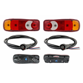 Komplet 2 lampy tylne 2 wtyczki tył Nissan Cabstar Atleon Renault Maxity