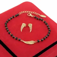 KOMPLET ZŁOTY SKRZYDŁA 2 CZ KORALIKI STAL CHIRURGICZNA