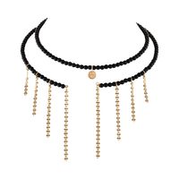 Elastyczny choker z onyksów, z wiszącymi łańcuszkami (C25/MEM/10AU)