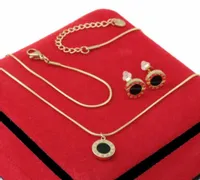 KOMPLET ZŁOTY ŻMIJKA CZARNE OCZKO ZEGAR STAL CHIRURGICZNA