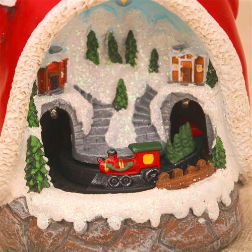 Figurka Święty Mikołaj z poruszającym się pociągiem światłami LED muzyką na Arena.pl