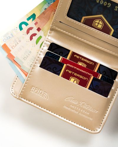 mały portfel damski ze skóry ekologicznej na zatrzask i suwak - peterson na Arena.pl