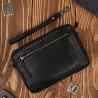 skórzana saszetka męska do ręki z odpinanym paskiem