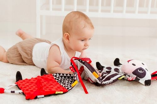 BaliBaZoo KSIĄŻECZKA HARMONIJKA KRÓWKA sensoryczna do łóżeczka dwustronna na Arena.pl
