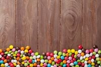 FOTOTAPETA kuchenna DESKI KOLOROWE CUKIERKI