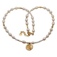 Naszyjnik - Białe Perły hodowane, hematyt, zawieszka słońce i srebro złocone