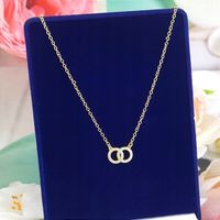 ŁAŃCUSZEK złoty zawieszka obrączki cyrkonie kółka celebrytka na szyję stal