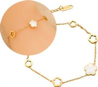 Bransoletka pozłacana stal chirurgiczna biały kwiatek