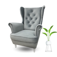 FOTEL USZAK NA DREWNIANYCH NÓŻKACH PIKOWANY