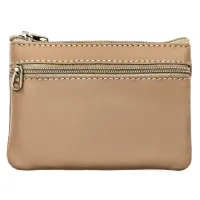 skórzana kluczówka w beżowym kolorze zamykana suwakiem