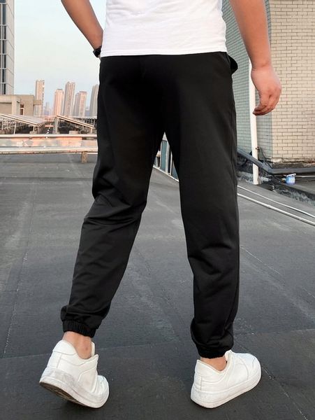 CZARNE SPODNIE DRESOWE JOGGERY KLASYCZNE GŁADKIE GUZIKI SHEIN S zdjęcie 5