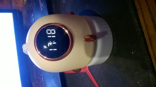 Lampka nocna z projektorem i zegarem - ecru/beż na Arena.pl