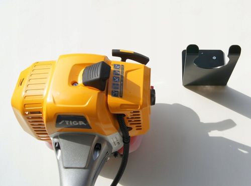 WIESZAK UCHWYT DO ŚCIANY MOCOWANIE DO KOSY SPALINOWEJ PODKASZARKI na Arena.pl