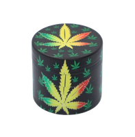 Grinder z Liściem Marihuany Kolor Reggae Otoczony Małymi Zielonymi Listkami