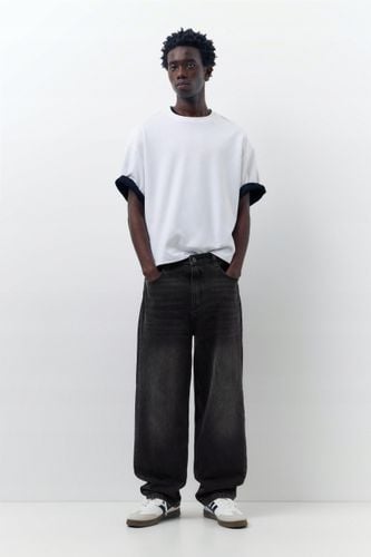 Pull&Bear czarne spodnie jeansy baggy 42 na Arena.pl