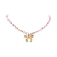 choker z różowych opali z kokardką zdobioną kryształkami aria